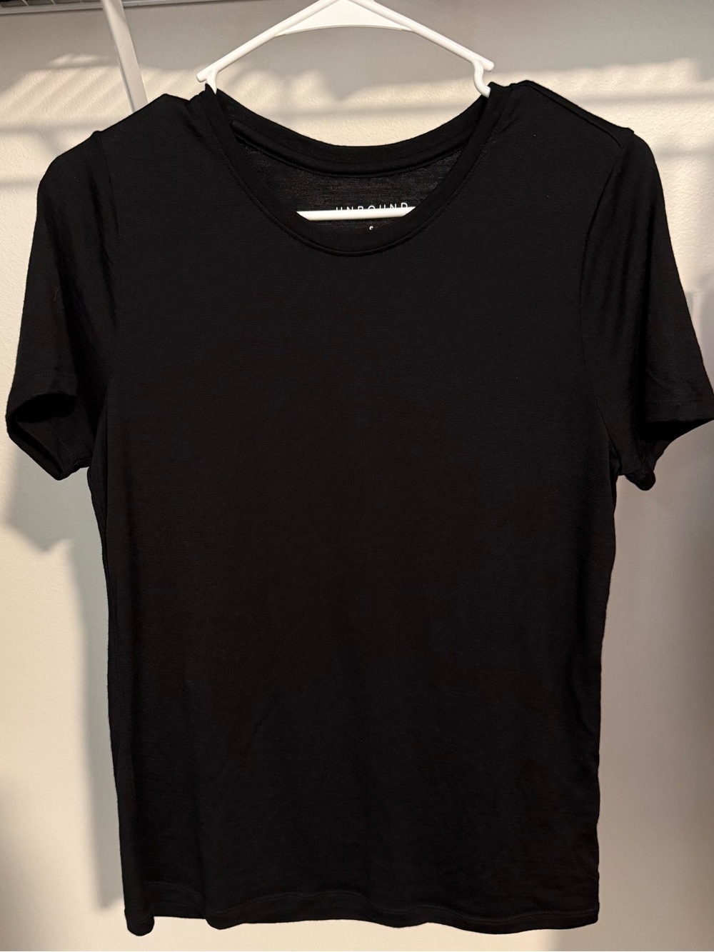SOLD ON CROSSPOST - Unbound Merino Black  Women’s tee, size small